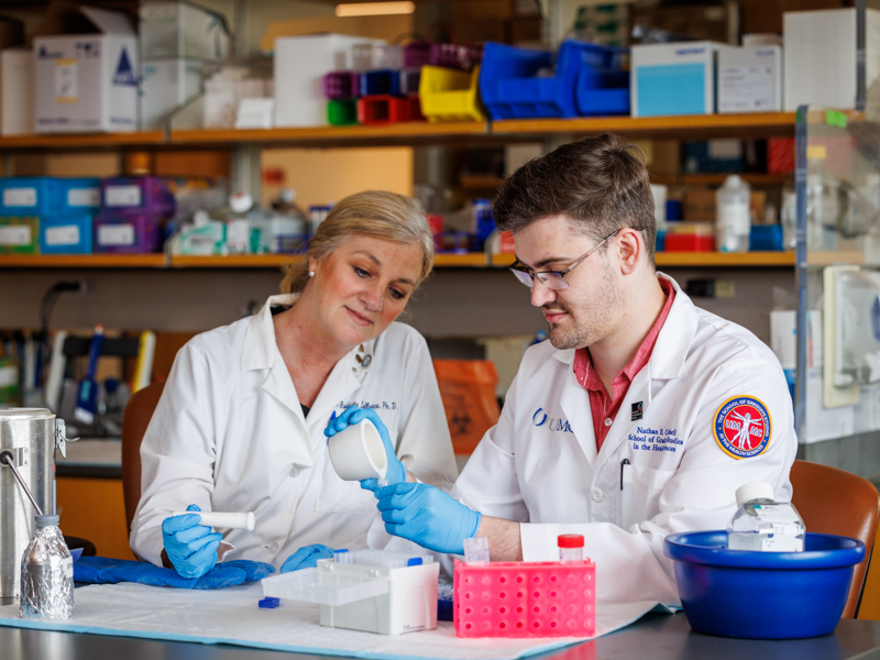 Nathan Campbell with Dr. Babbette LaMarca, professor and chair of the Department of Pharmacology and Toxicology and professor of Obstetrics and Genecology.