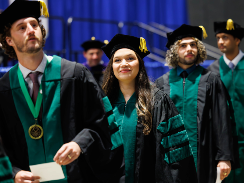 On her way to a residency in OB-GYN, Dr. Adrian Oudomrath Speyrer lines up to receive her medical degree during May's Commencement ceremony. Perhaps she is remembering her first OB-GYN shift as a medical student, when "it felt like stepping onto the field for the Super Bowl."