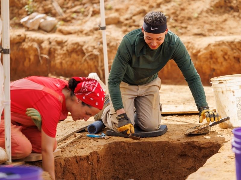 Bryan Hill, a University of West Florida graduate student, works alongside Stacia Yoakam, a member of the professional archaeological crew.