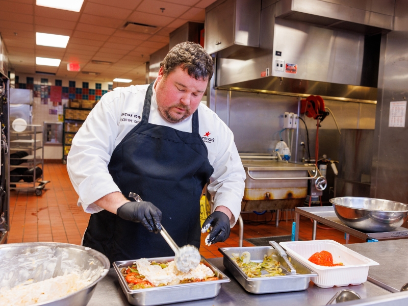 Back at work at UMMC after his adventures on "Hell's Kitchen," Chef Jonathan Boyd prepares the popular John Wayne Casserole for discerning Medical Center diners.