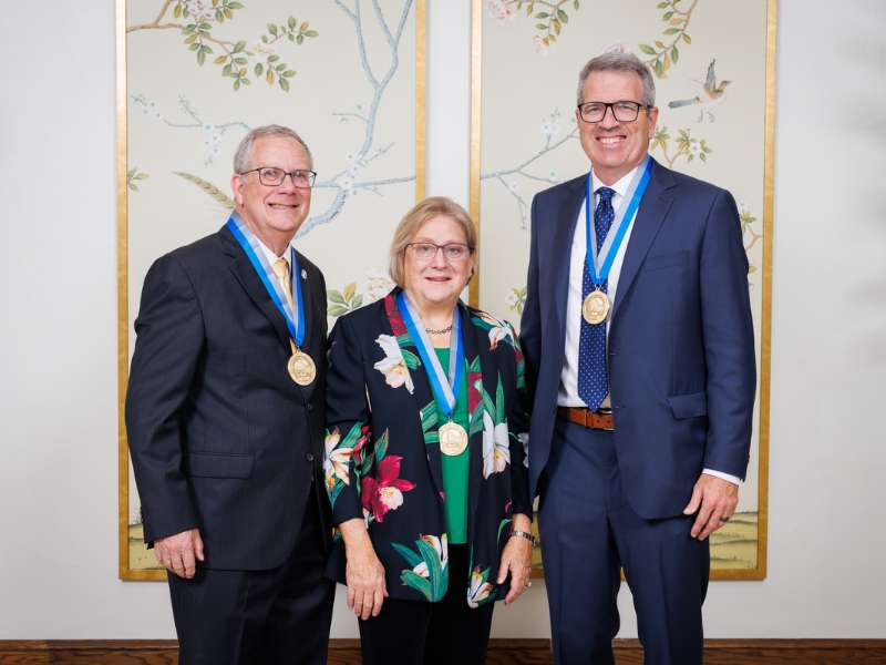 Drs. Linda and Robert Brodell pose with the inaugural recipient of their endowed chair in dermatology, Dr. Jeremy Jackson.