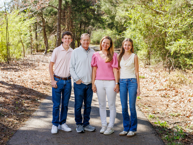 Wade Watts enjoys an afternoon outside with his family, from left, his son Everett; his wife, Sara; and his daughter Chaney Claire.