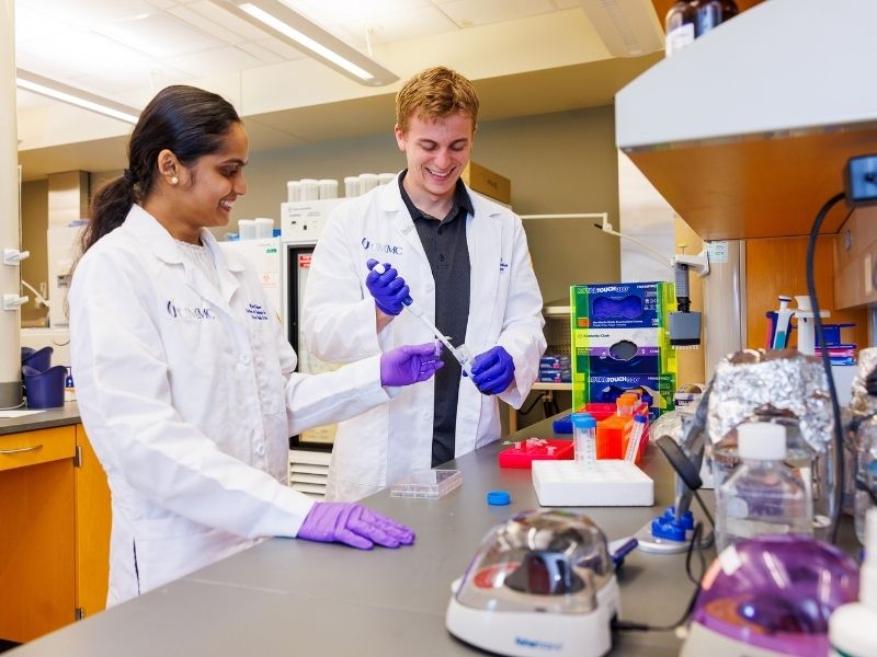 Cancer Biology and Therapeutics students Rhea Kishore are at work in the lab.