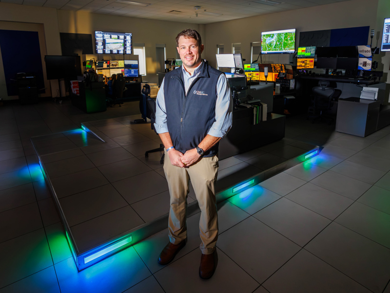 Will Appleby, manager of MED-COM, stands in the emergency transfer center of Mississippi MED-COM.