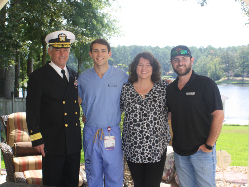 Dr. Nick Gaouette, second from left, stands with his father, in uniform, his mother and his brother on Sept. 20, 2023, the day he was commissioned as an officer in the U.S. Navy.