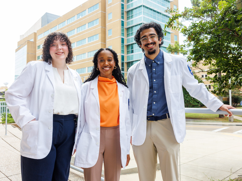 UMMC medical students Allie Koenig, Alexisa Woodard and Rohinton Dossabhoy are among the inaugural cohort pursuing UMMC's new MD-MPH pathway. The program combines medical education with advanced training in population health.