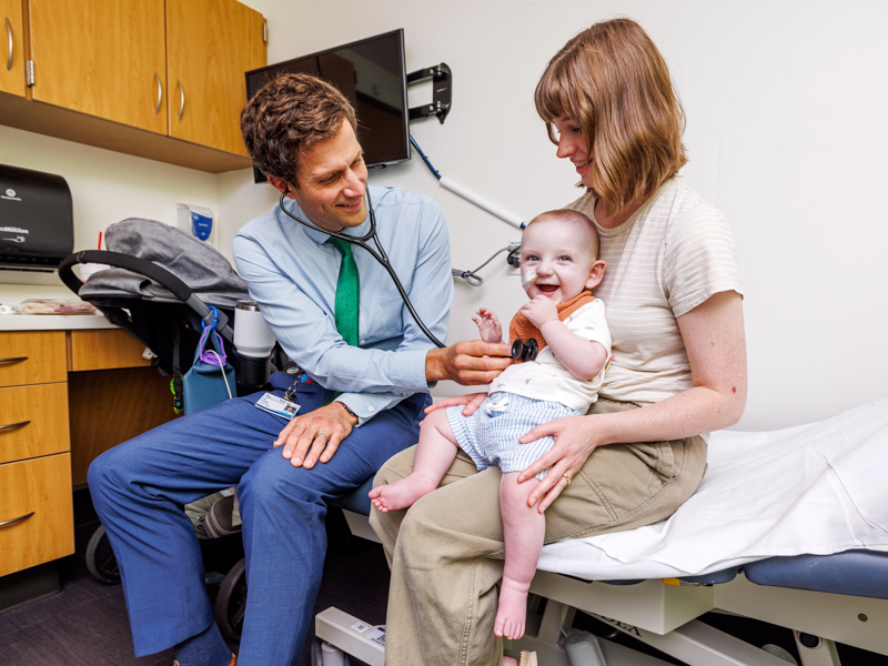 Dr. Erik Frandsen, pediatric cardiologist at the children's hospital, meets with Duncan Robertson, 1, of Laurel and his mom Hannah.