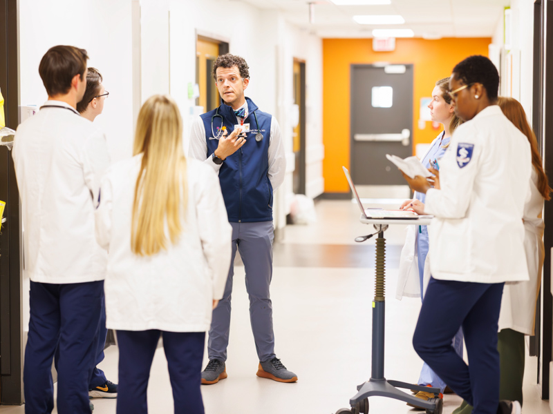 Dr. Mitchell Hobbs, director of the pediatric hospital medicine fellowship program begins morning rounds in the Batson Tower of the children's hospital.