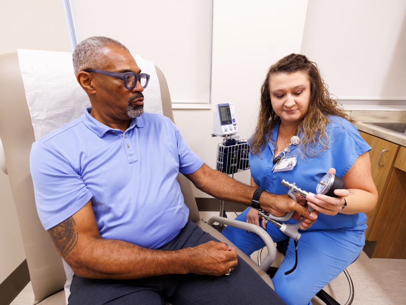 Martin completes a grip-strength assessment as part of the MIND Center Study of Aging. Researchers measure and compare participants' strength over time to track changes associated with aging.