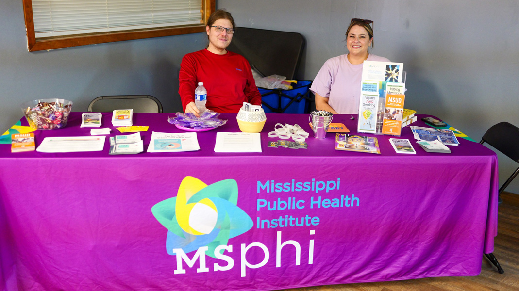 MSPHI resource table with two representatives sitting behind it.