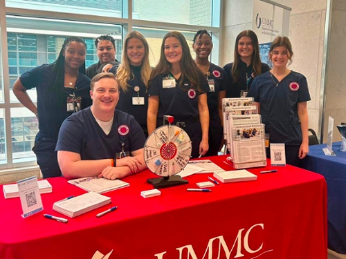 SON students at a high school career fair booth