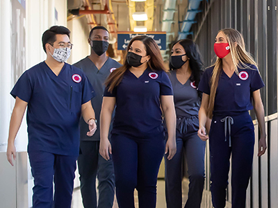 nursing students walking down a hallway at an academic medical center