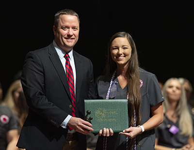 DAISY student nurse award presented to Jordan Barksdale from Dr. Joseph Tacy.