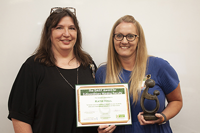 Dr. Katie Hall receiving her DAISY Faculty Award from Dr. Tina Ferrell.