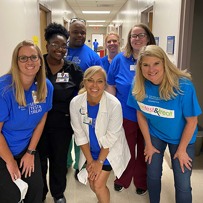 aSON faculty volunteering time at a free cancer screening day.