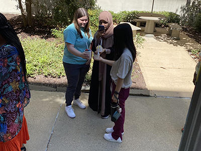 nursing student line up at frozen treat truck to get ice cream