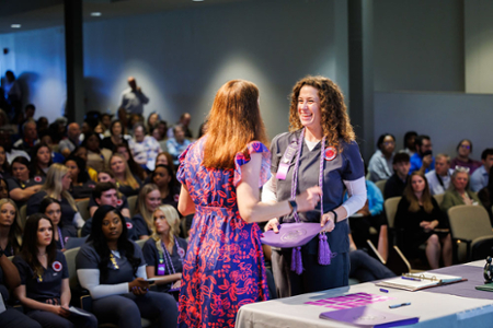 nursing student being inducted into Sigma International Nursing Society during her Pinning ceremony